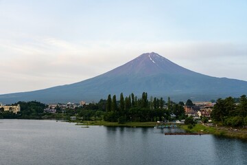 Beautiful perspective of Mount Fuji towering over a small town in Japan