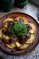 Chicken liver with apples, cherry sauce and arugula