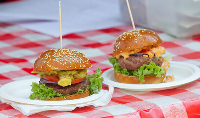 Freshly prepared hamburgers waiting for their customers at the farmers market snack stand