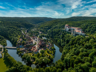 Fototapeta na wymiar Aerial panorama view of the Thaya river curving at Vranov nad Dyji with old Gothic castle structure turned into a representative Baroque residence with the extensive landscape park