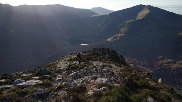 A backpacker hiking the beautiful mountains of North Wales UK