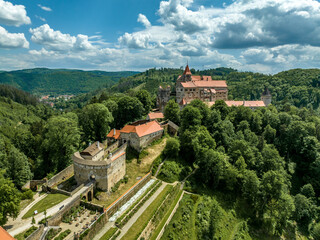 Aerial view of Pernstejn castle with barbican and moat protecting the entrance