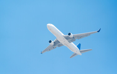 White passenger plane taking off