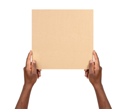 Man holding a blank rectangular piece of brown cardboard isolated on white or transparent background