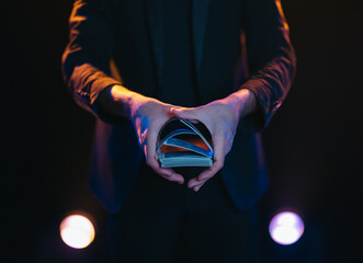 Man showing magic trick on stage