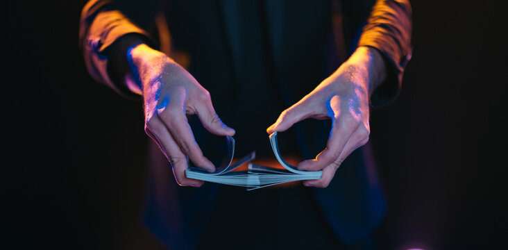 Man showing magic trick on stage