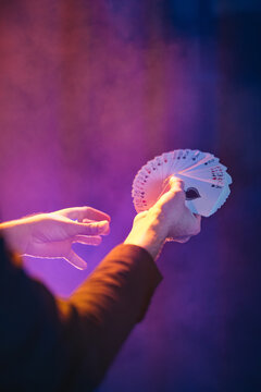 Man with fanned out cards