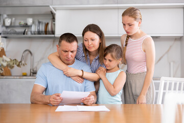 Upset family with documents having financial problems