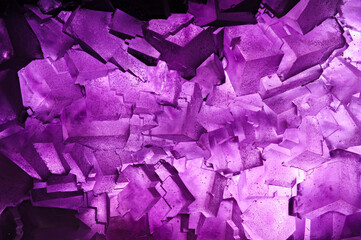 purple cubic fluorite crystal backlit. macro detail texture background. close-up raw rough unpolished semi-precious gemstone - obrazy, fototapety, plakaty