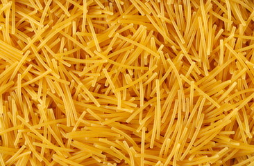 Italian uncooked pasta soup background and texture