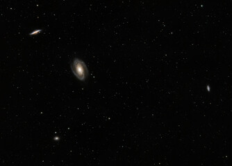 The interacting duo M81 (Bode's Galaxy) and M82 (Cigar Galaxy) sit roughly 12 million light years away in the constellation Ursa Major.