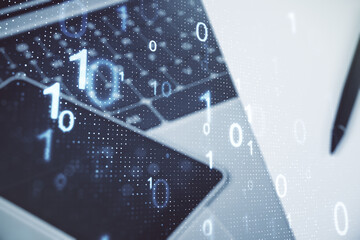 Double exposure of creative abstract binary code hologram on laptop background. Database and programming concept