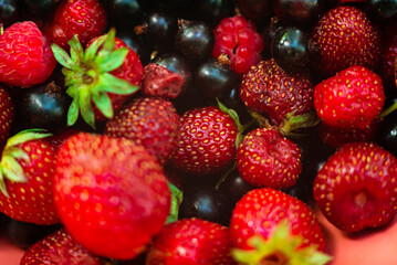 Ripe, fragrant, bright summer berries strawberries, currants, strawberries close-up. Juicy, appetizing look. Background