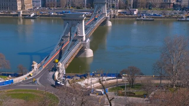 Famous secheni bridge over river. A view of sunny Budapest chained Secheni bridge over Danube river.