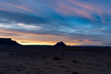 Factory Butte in the Utah desert at sunset