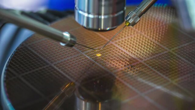 Check Micro Electronic Chip Under A Microscope.