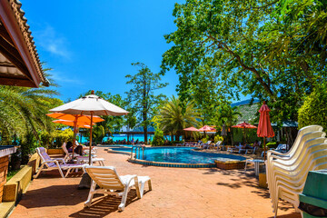 Bungalows houses, coconut palms and swimming pool on Ko Phi Phi Don Island on a sunny day, Ao Nang, Mueang Krabi District, Krabi, Andaman Sea, Thailand