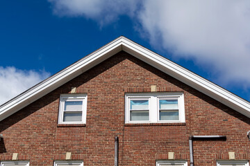 Brick house gable end windows exterior view, Boston city, MA, USA
