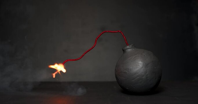 Round black bomb with lit fuse burning with sparks. Symbolizing fear, crisis, or dangerous violence.