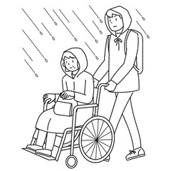 雨の中を避難する車椅子に乗った高齢女性と支援する男性