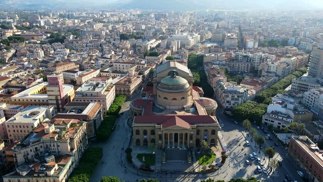 Aerial shot drone hovers directly in front of Teatro Massimo at sunset in Palermo, Sicily, Italy