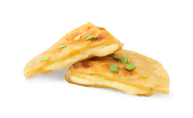 Cut delicious fried cheburek with cheese and green onion isolated on white