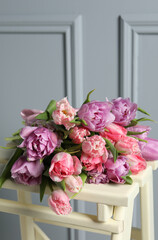 Beautiful bouquet of colorful tulip flowers on stool