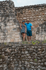 couple posing among the ruins of Ek Balam Archaeological Zone in the Mayan Riviera Yucatan Mexico
