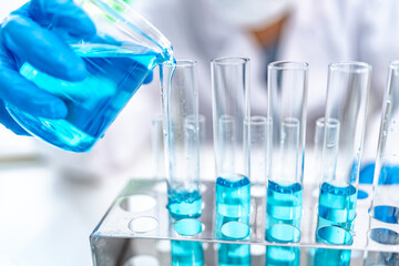 Chemical laboratory research with scientific tube and flask glassware equipment, science medicine liquid experiment test on Chemistry, Biotechnology, or Biology for business medicals development