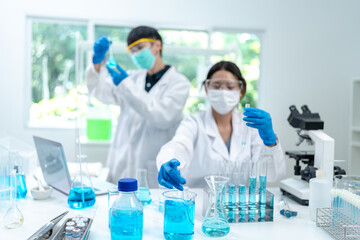 Fototapeta premium Chemical laboratory research with scientific tube and flask glassware equipment, science medicine liquid experiment test on Chemistry, Biotechnology, or Biology for business medicals development
