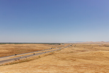 Beautiful summer landscape in California with yellow dry grass aerial view. Panorama