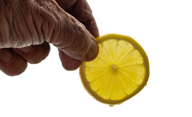 Hand holding a slice of lemon on a transparent background