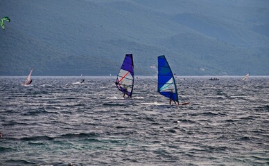 Windsurfers surfing on waves in Viganj on Peljesac peninsula, Croatia