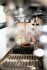 Iced coffee in plastic cup on table in coffee shop