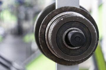 Barbell discs hanging on a rack in the gym. Copy space