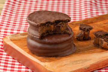 Traditional alfajor on cutting board.
