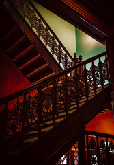 stairs in window light with decorative railings