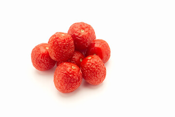 A pile of rotten tomatoes is on a white background.