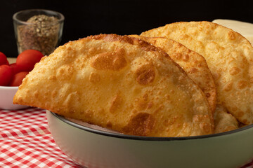 Delicious Brazilian pastel in a plate.