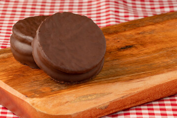 Traditional alfajors on cutting board. Copy space.