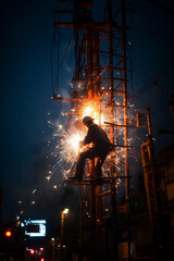 Light spark of welding sitting on the electric pole