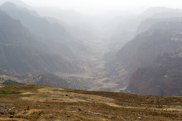 Naklejka premium Beautiful sunset landscape at King`s Highway in Jordan somewhere between Petra archeological site and the Dead Sea. The King’s Highway was an ancient trade route connecting Africa with Mesopotamia
