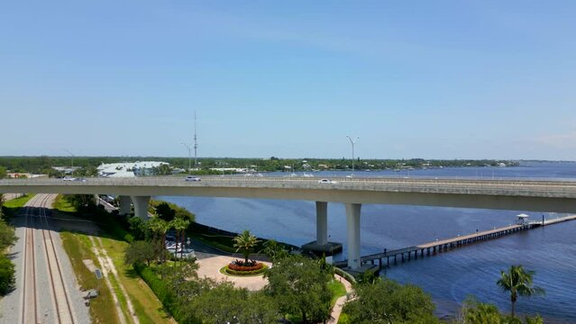 Aerial reveal marina with boat yacht Stuart Florida NW Federal Highway Roosevelt Bridge