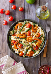 Pasta with shrimp, asparagus and tomatoes. Healthy eating. Diet.