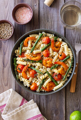 Pasta with shrimp, asparagus and tomatoes. Healthy eating. Diet.