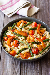Pasta with shrimp, asparagus and tomatoes. Healthy eating. Diet.
