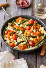 Pasta with shrimp, asparagus and tomatoes. Healthy eating. Diet.