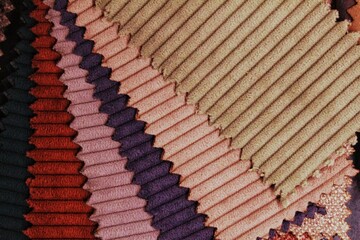 Close-up of colorful upholstery fabric samples. Textile texture background
