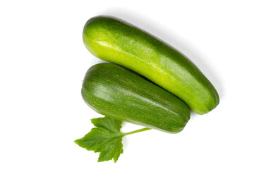 Fresh green zucchini on a white background. A couple of natural organic zucchini.