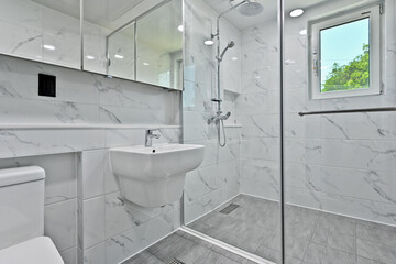 Nice modern interior bathroom decorated with Bianco tiles